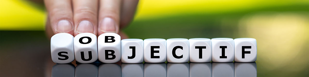 Série de dés sur lesquels sont écrits les lettres du mot OBJECTIF.