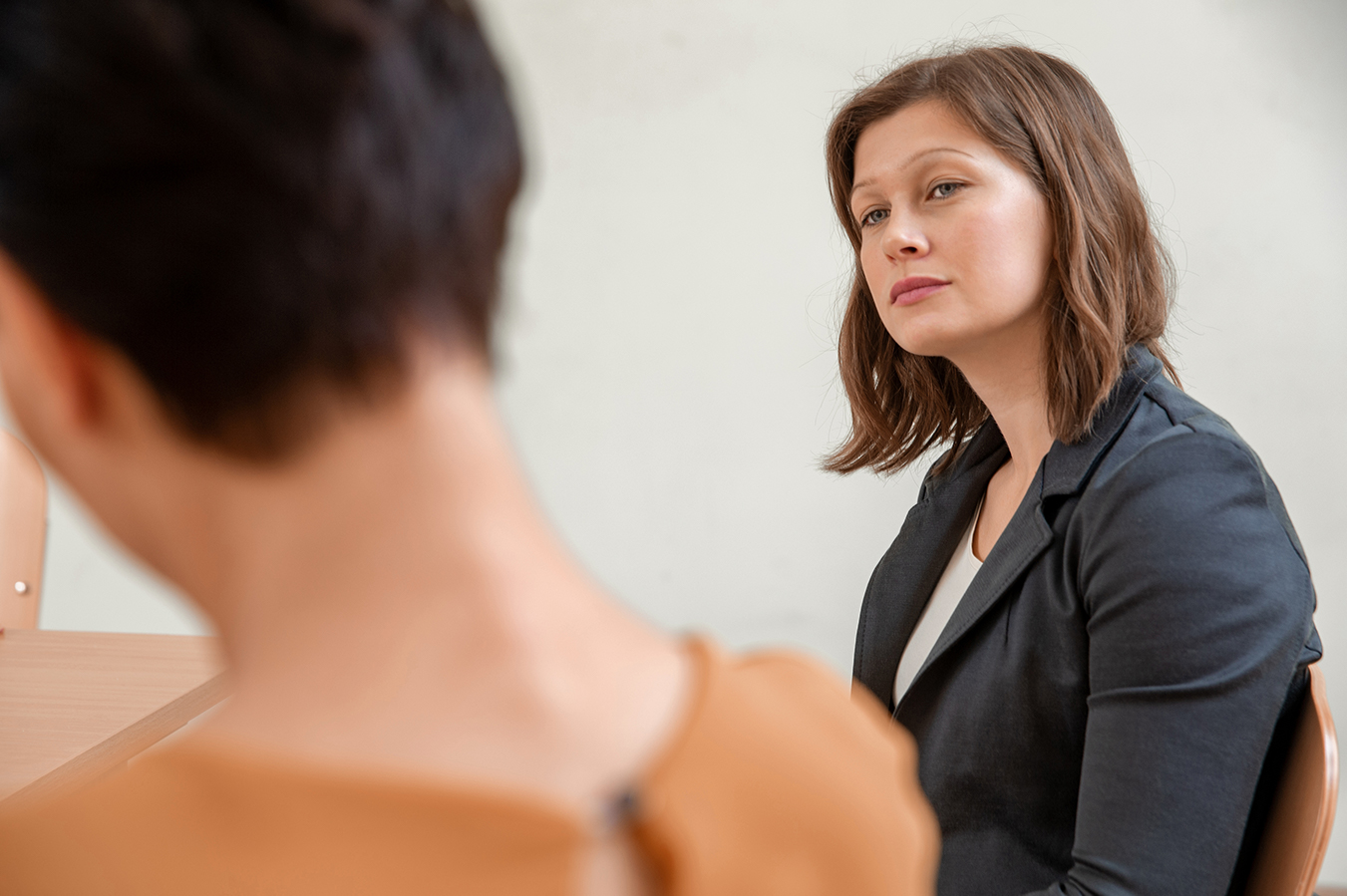 A trainee looks at her supervisor with contempt. 