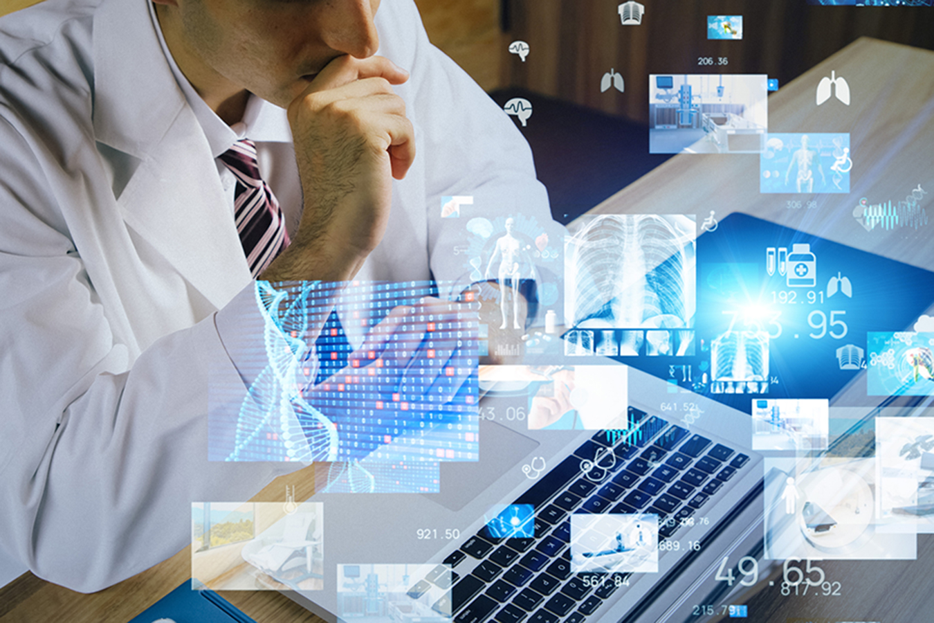 A man, thinking, sitting in front of his computer.