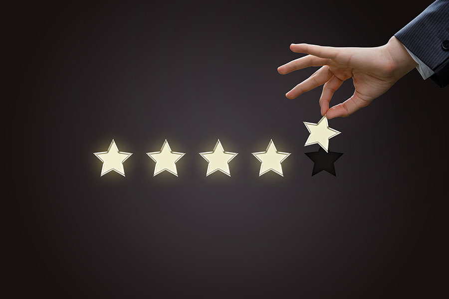 A hand takes out a star from the assessment.