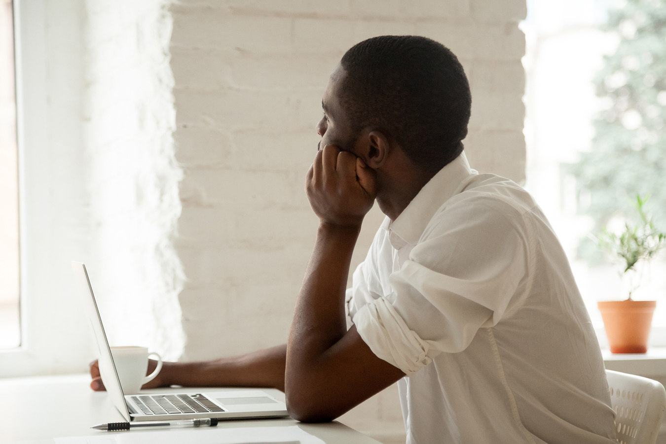 A student sitting in front of his computer 